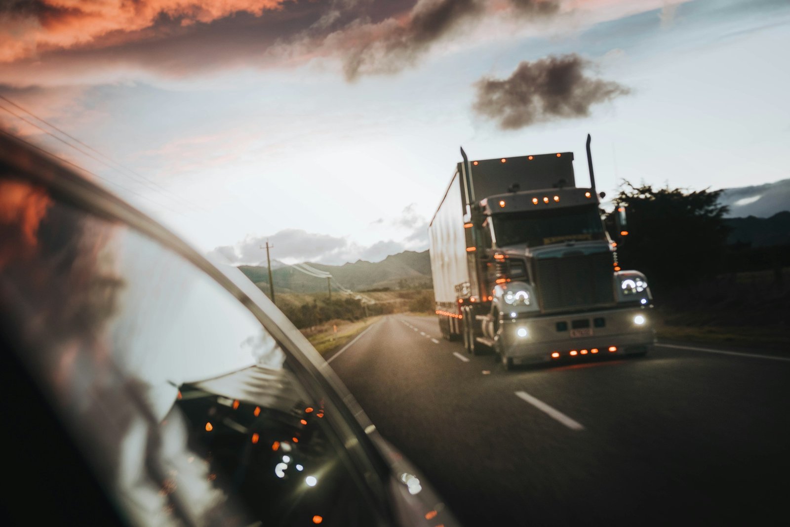 Courier truck on highway at night